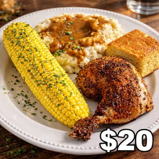 Homestyle roasted chicken plate with buttery corn, mashed potatoes and gravy, cornbread 